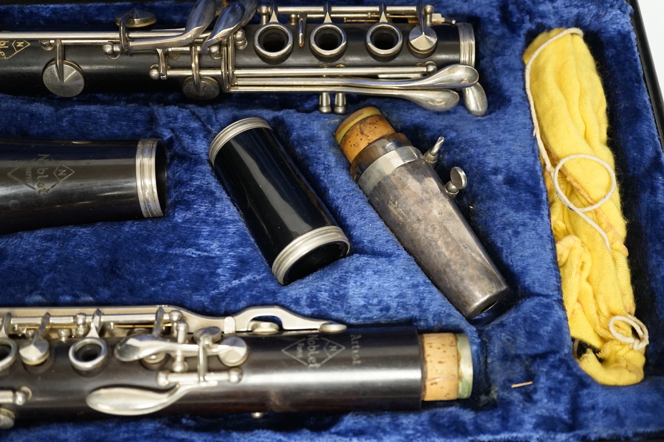 A cased French clarinet by Noblet, Paris